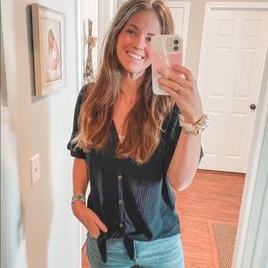 Large navy knit top. Fits like medium! Functional buttons & cute tie detail.